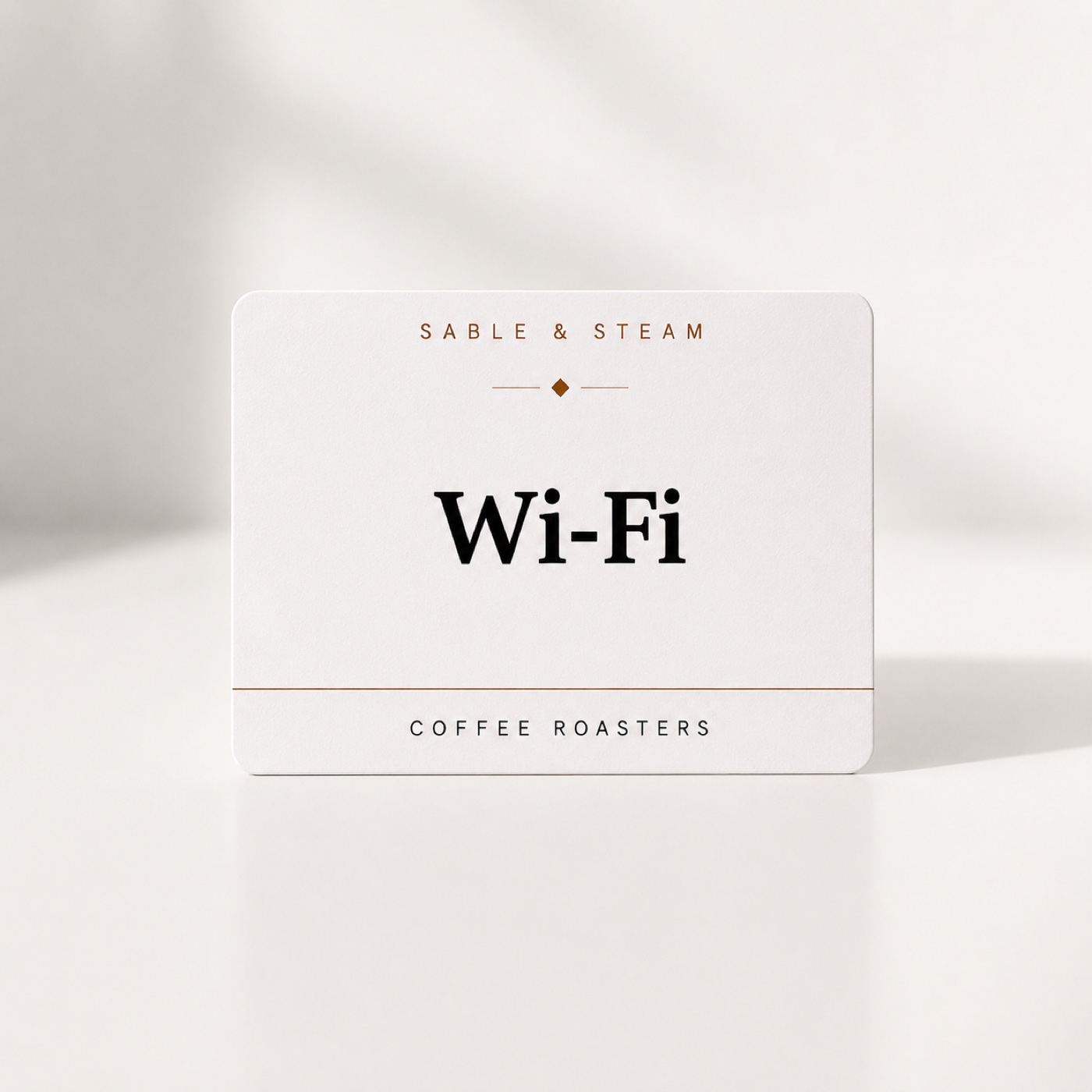 White NFC tap card reading Sable & Steam, Wi-Fi, Coffee Roasters