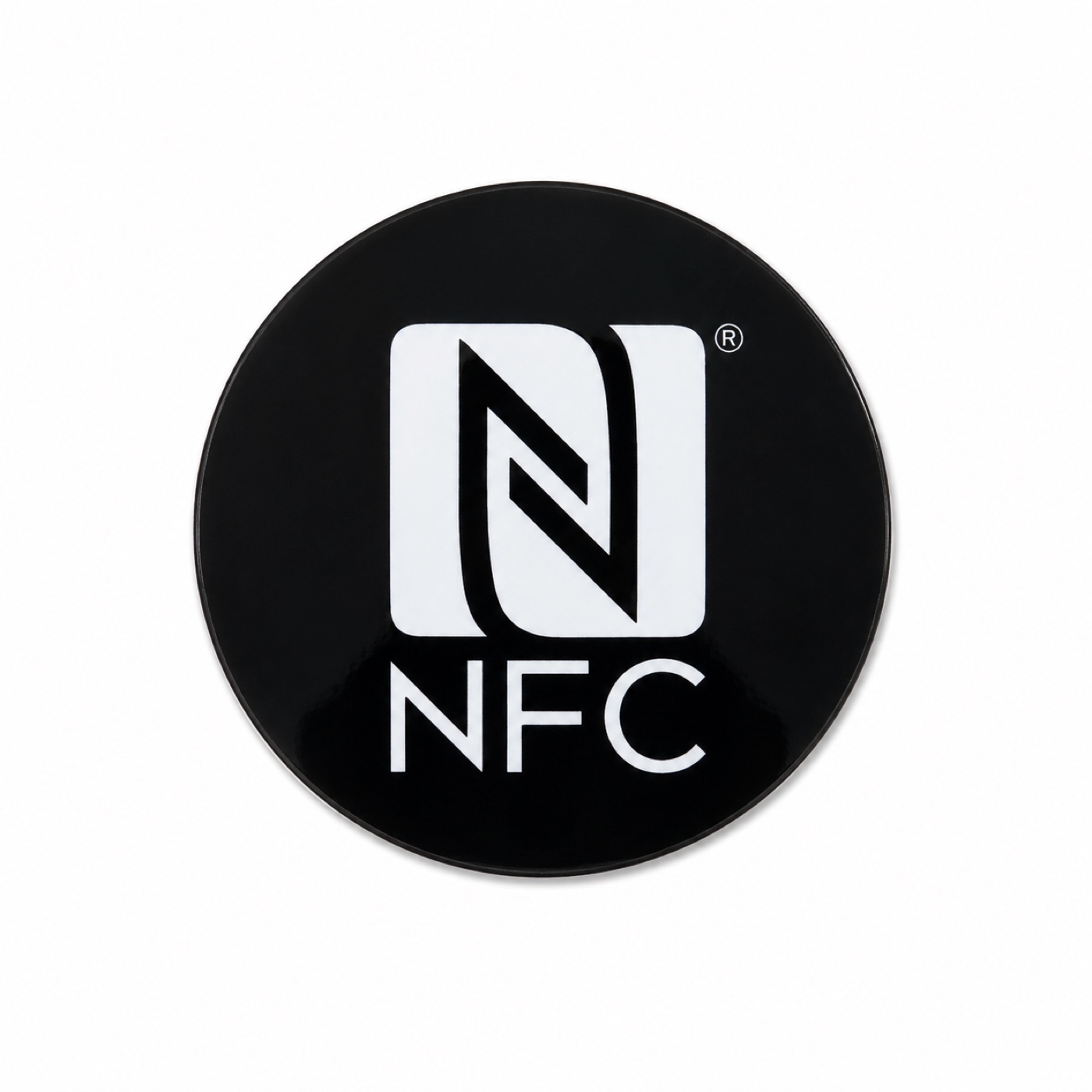 Round black NFC tap tag with the NFC mark, on white