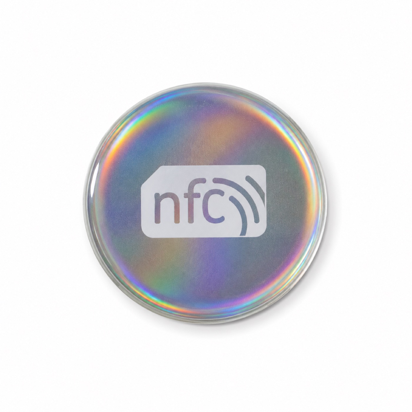Round holographic NFC tap tag on a white surface