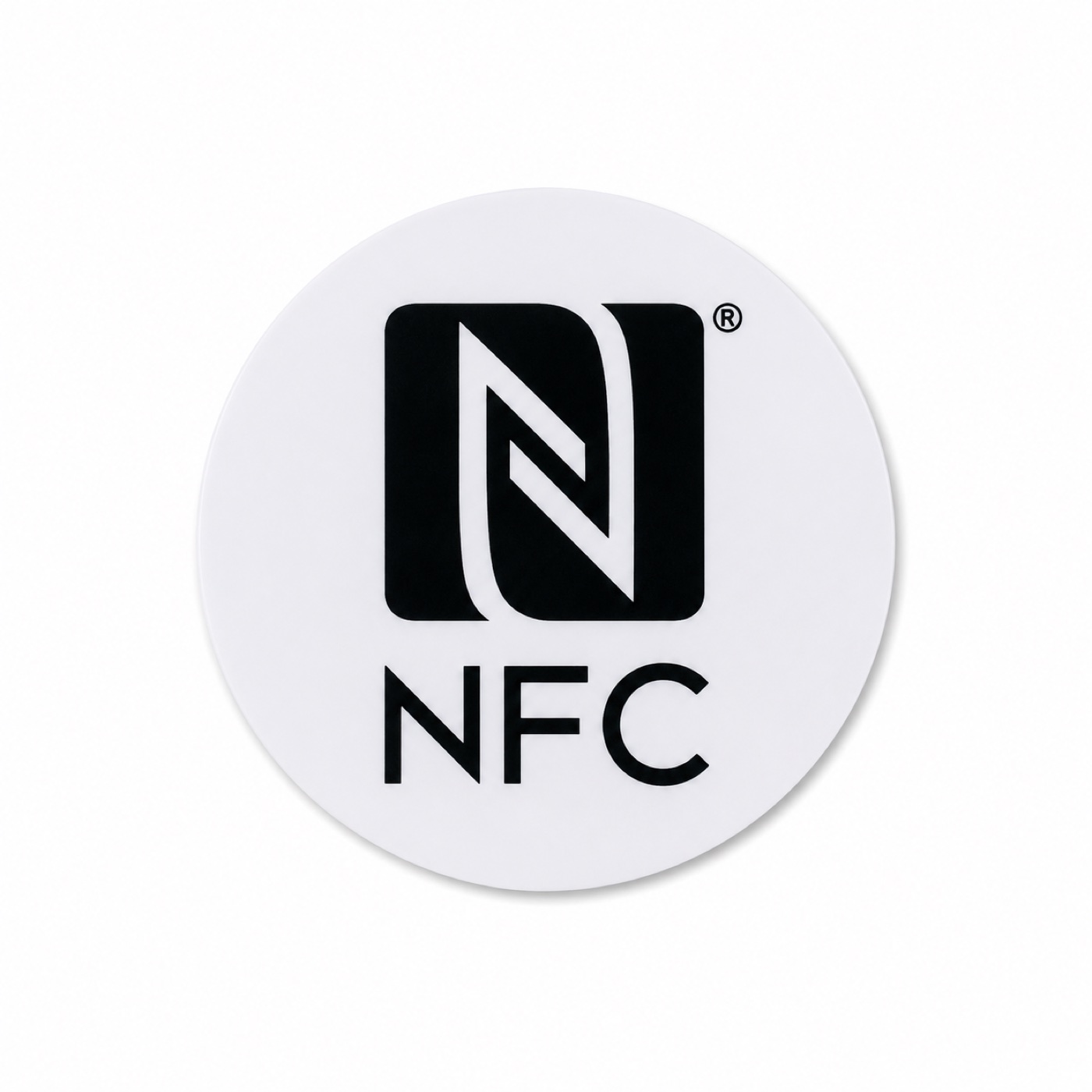Round white NFC tap tag with the black NFC mark, on a white surface